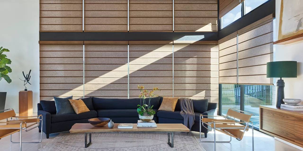 Modern sunroom with windows outfitted with Hunter Douglas Designer Solar Shades near Federal Way, WA 