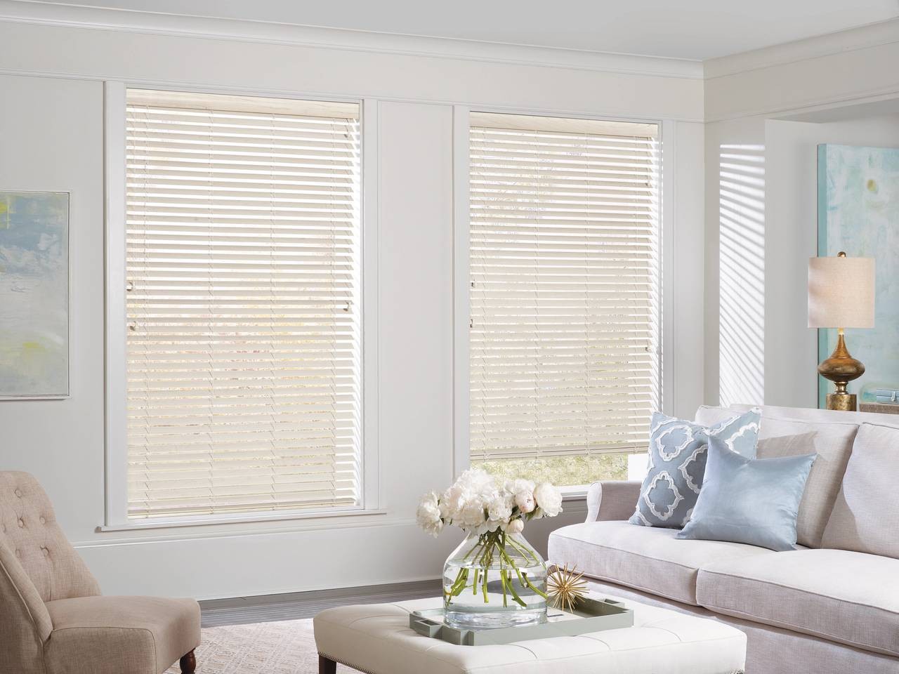 Sunlit living room with Hunter Douglas EverWood® Alternative Wood Blinds decorating two windows near Federal Way, WA