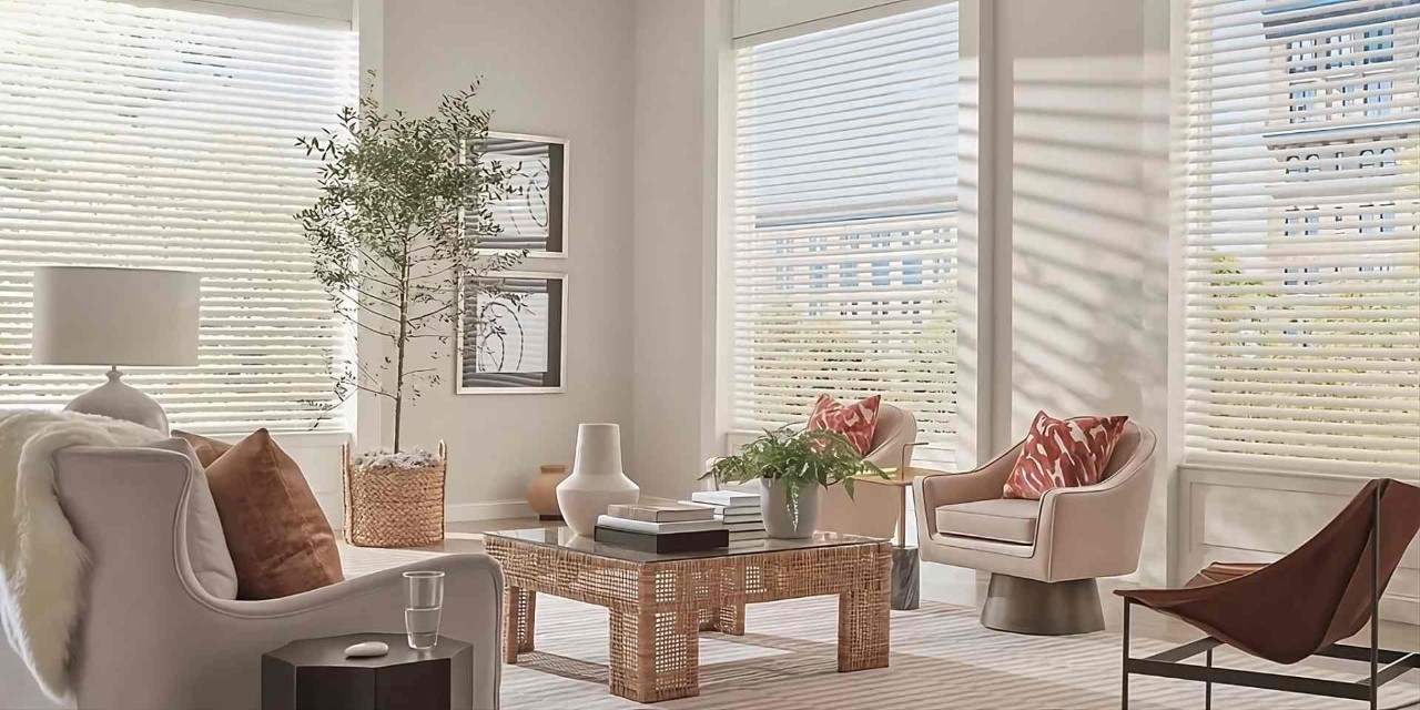 Hunter Douglas Aria™ Fabric Blinds in an inviting and open living room with a Pebble® Remote at Geneva’s Interiors near Federal Way, (WA)